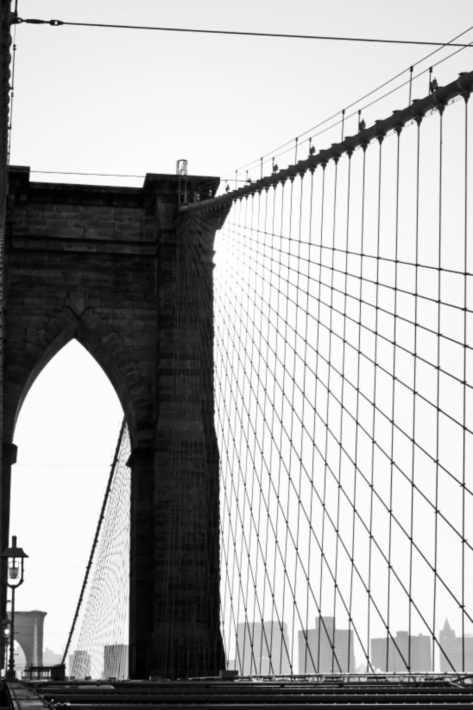Brooklyn Bridge tower and cables in black and white