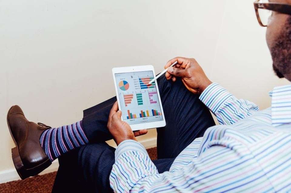 Consultant reviewing charts on a tablet